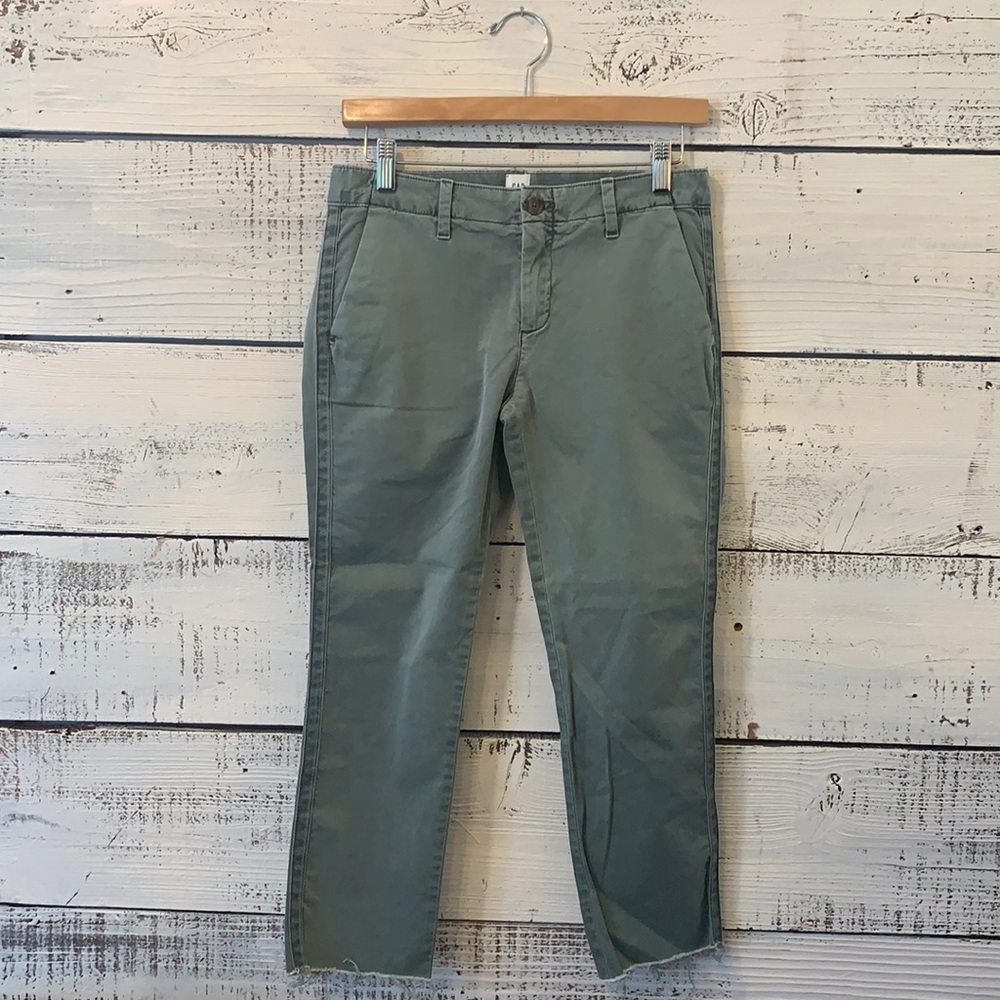 These are seven pair of XS women’s green pants.